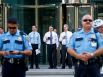 Workers from inside the J.P. Morgan Chase Tower watch the protestors with the Occupy Houston movement, an outgrowth of the Occupy Wall Street protests in New York, as they gathered in downtown Houston to denounce what they describe as social and economic equality and corporate greed, Thursday, Oct. 6, 2011, in Houston.