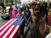 CODY DUTY : CHRONICLE MAKING A STATEMENT: Occupy Houston protesters march to Wells Fargo Plaza on Friday in Houston. They also marched on four banks: Bank of America, JP Morgan Chase, Wells Fargo and Amegy. The demonstrators say they're against corporate greed and economic inequality.