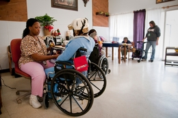 Austin State-Supported Living Center employee Tamika Mays is shown with resident Rebecca Hadnot in 2011.