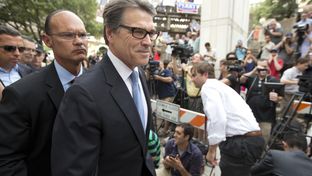 Gov. Rick Perry leaves the Blackwell-Thurman Justice Center in Austin after his booking on Aug. 19, 2014.