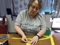 
Jo Ellen McCracken, a volunteer at for Alliance for Suicide Prevention, makes ribbons for No Shame November, a series of awareness and fundraising events to encourage positive discussion of mental health issues and suicide prevention.
