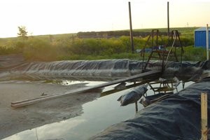 This photo, taken Oct. 5, 2007, is of the underground injection disposal well site outside Fort Worth, Texas, that had passed the Railroad Commission's inspection on Sept. 27, 2007. On their second visit two months later, inspectors found several violations, including dikes that did not meet the facility's holding capacity. (Photo courtesy of Sharon Wilson)