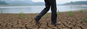 A man walks along the dried-up the banks of the Yangtze river, China's longest and most economically important river, in Wuhu, east China's Anhui province on May 27, 2011, where water levels have been 40 percent lower than average levels of the past 50 years.