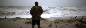 Andy Becica stands on the beach watching the heavy surf from Hurricane Sandy wash in in, on October 29, 2012 in Cape May, New Jersey. Later today the full force of Hurricane Sandy is expected to hit the New Jersey coastline bringing heavy winds and floodwaters.