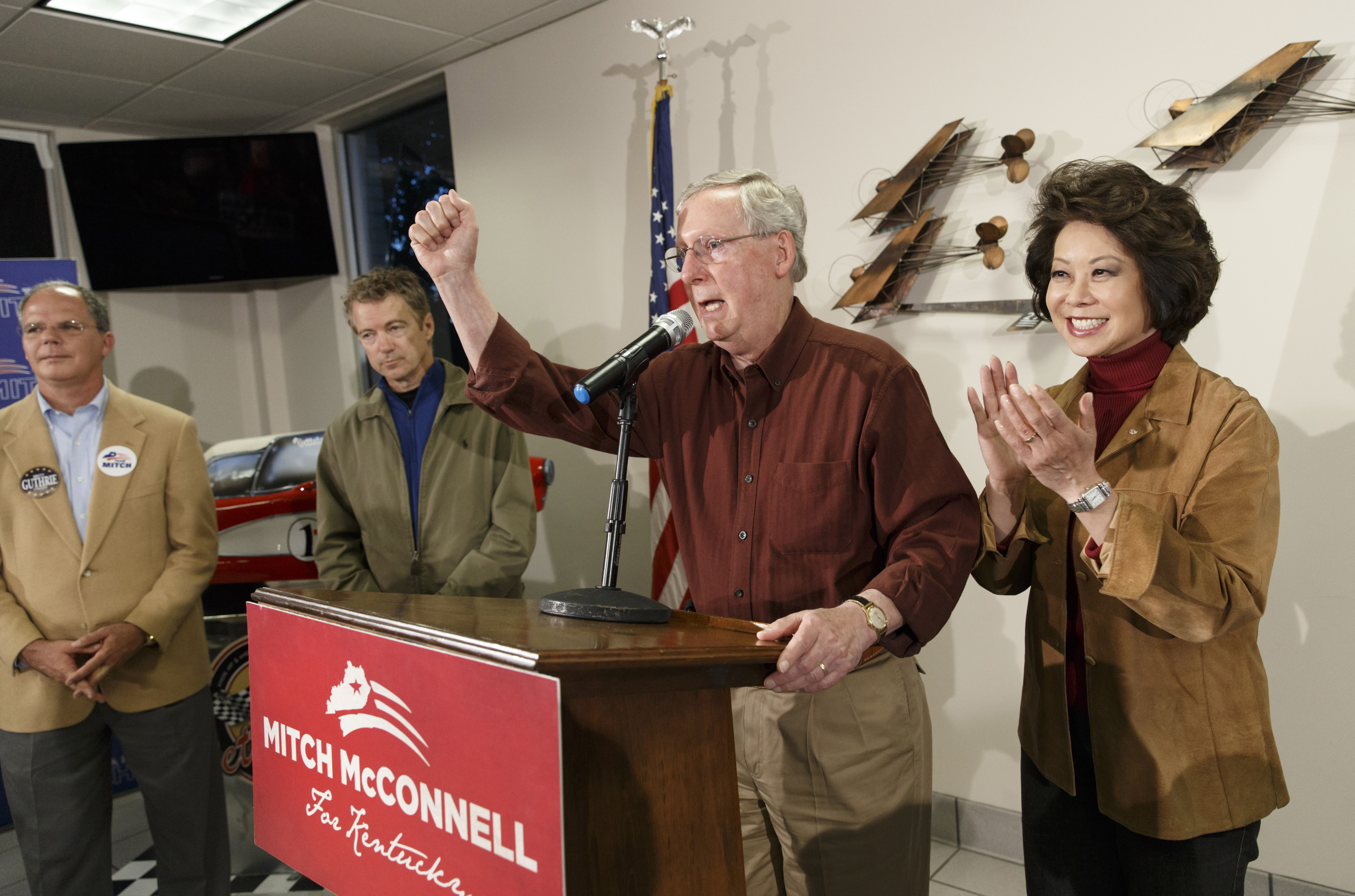 On his final campaign stop, Senate Minority Leader Mitch McConnell, R-Ky., gets a campaign assist from his wife, right, former Labor Secretary Elaine Chao, Sen. Rand Paul, R-Ky., second from left, and Rep. Brett Guthrie, R-Ky., far left, as they arrive at the Warren County Regional Airport in Sen. Paul's hometown, Bowling Green, Ky., Monday, Nov. 3, 2014. McConnell, a 30-year incumbent, would ascend to majority leader if he holds his seat and Republicans take control of the Senate in Tuesday's midterm election.   