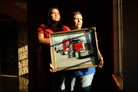 *** LISE OLSON STORY TO BE PUBLISHED IN SEPTEMBER ***  Frances Quintanilla and mother Rebecca Quintanilla hold a photograph of deceased family member, Guadalupe Quintanilla, who was killed in a head-on collision caused by a commercial driver who was dispatched to the Eagle Ford in a truck with bald tires on May 28, 2014, in Harligen, Tx. The two drivers lost their lives in the accident when the commercial driver lost control of his truck. The Quintanilla family filed a wrongful death lawsuit against Turn Around Trucking, who copied and pasted a safety manual from a Houston based hauling company and handed it to drivers.
