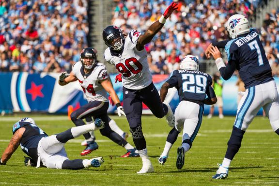 Houston Texans outside linebacker Jadeveon Clowney (90) applies pressure to Tennessee Titans quarterback Zach Mettenberger (7) during the first half an NFL football game at LP Field on Sunday, Oct. 26, 2014, in Nashville. ( Smiley N. Pool / Houston Chronicle )
