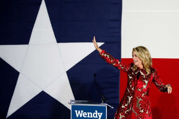 Democratic gubernatorial candidate Wendy Davis waves to supporters after conceding Tuesday in Fort Worth, telling them "the only way that we will have lost tonight is if we stop fighting."
