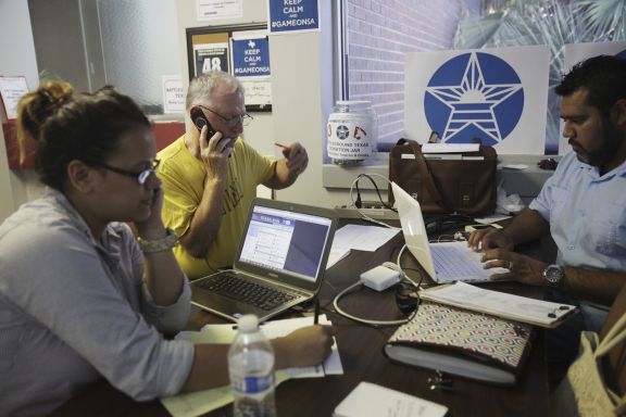 Miki Ramos, left of San Antonio, Battleground Texas Organizer, John Merson, center of San Antonio, volunteer, and Alex Champeron, right of Shertz, Battleground Texas Organizer, make calls at the Battleground Texas phone bank at the Bexar County Democratic Party headquarters on Thursday, July 18, 2013. The goal of Battleground Texas is to get more people out to vote because Texas is the 48th in voter turnout, and to return Democrats to state offices held by Republicans for the past two decades.