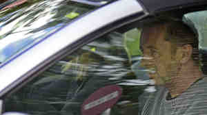 Phil Rudd, the drummer for rock band AC/DC, leaves a court house in Tauranga, New Zealand, on Thursday.