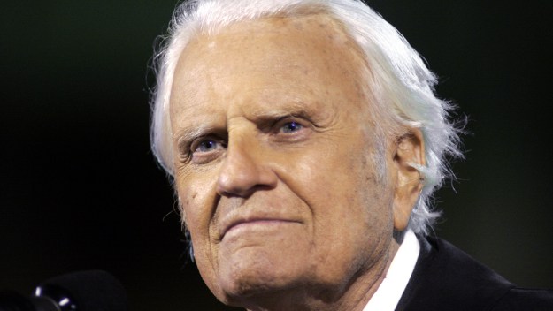 Rev. Billy Graham speaks in Kansas City, Mo during his 2004 "Heart of America" crusade. (Photo by Larry W. Smith/Getty Images)