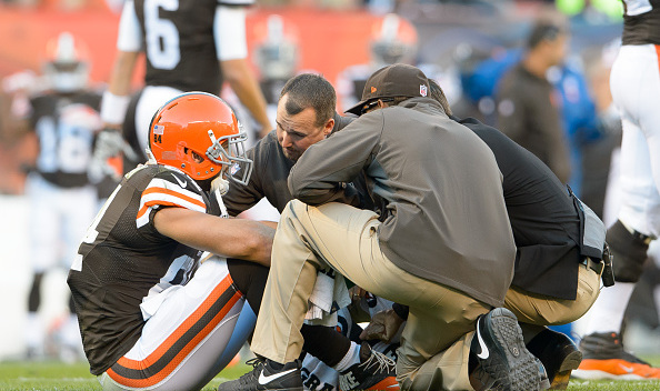 Tight end Jordan Cameron #84 of the Cleveland Browns sits on the field after taking a hard hit during the first half against the Oakland Raiders at FirstEnergy Stadium in Cleveland, Ohio. Cameron left the game after the play. (Photo by Jason Miller/Getty Images)