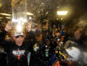 KANSAS CITY, MO - OCTOBER 29:  Bruce Bochy #15 of the San Francisco Giants celebrates with The Commissioner's Trophy in the locker room after a 3-2 win over the Kansas City Royals in Game Seven of the 2014 World Series at Kauffman Stadium on October 29, 2014 in Kansas City, Missouri.  (Photo by Ezra Shaw/Getty Images)