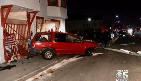 Scene where an SUV crashed into a home on 7th Street near Fallon in Oakland, November 6, 2014. (CBS)