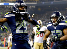 SEATTLE, WA - JANUARY 19: Cornerback Richard Sherman #25 of the Seattle Seahawks celebrates after he tips the ball leading to an intereption by outside linebacker Malcolm Smith #53 to clinch the victory for the Seahawks against the San Francisco 49ers during the 2014 NFC Championship at CenturyLink Field on January 19, 2014 in Seattle, Washington.