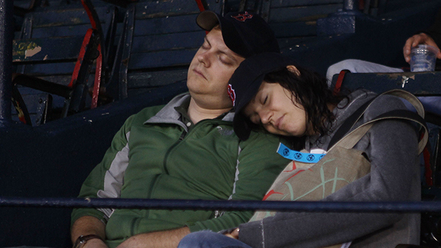 Fans take a nap on August 24, 2010 at Fenway Park. (Photo by Elsa/Getty Images)