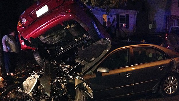 One car ended up on top of another on Childs Street in Lynn. (WBZ-TV)