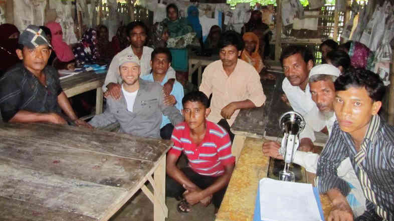 Poet Cameron Conaway (left, in gray cap) visits malaria-hit areas in the Chittagong Tract Hills, Bangladesh, in June 2012.