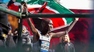 Wilson Kipsang of Kenya hoisted his country's flag after winning the New York City Marathon on Sunday. Kipsang won in an unofficial time of 2 hours, 10 minutes, 59 seconds.