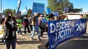 Supporters of Navajo presidential candidate Chris Deschene gather outside an administrative court in Window Rock, Ariz. Questions about his fluency in the Navajo language have dogged his campaign.