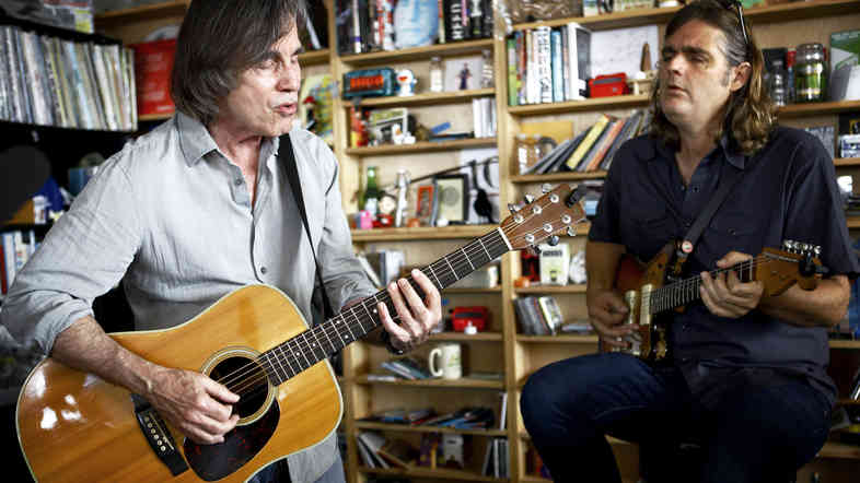 Jackson Browne (left) and Val McCallum preform a Tiny Desk Concert at NPR in Washington, D.C, Sept. 12, 2014..