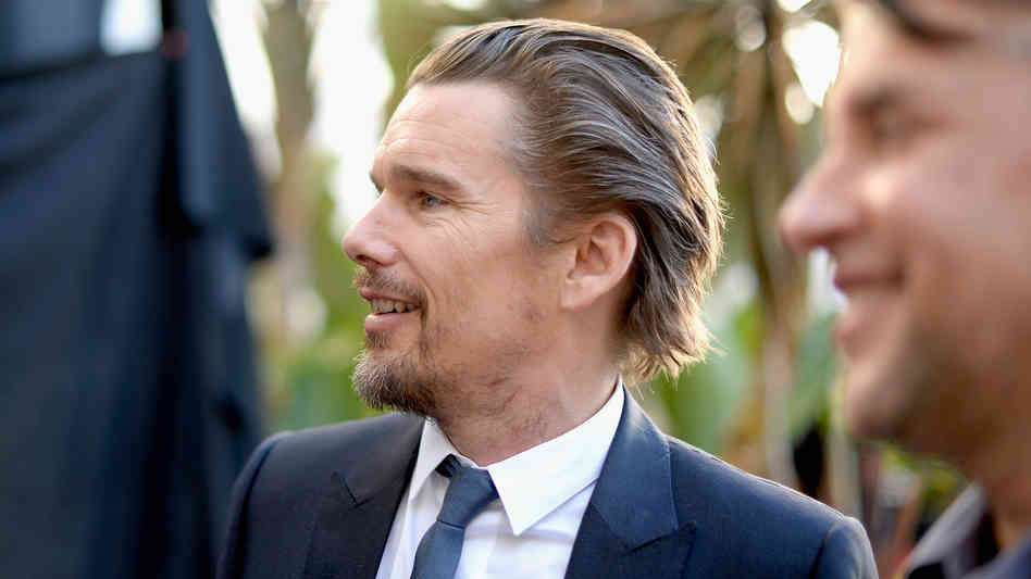 Ethan Hawke (with director Richard Linklater) at the 86th Academy Awards nominees luncheon.