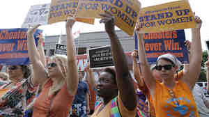Opponents and supporters of a law that restricts abortion in Texas rallied outside the Texas Capitol in Austin as the bill was debated in July 2013.
