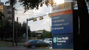 Traffic moves past Texas Health Presbyterian Hospital in Dallas, where a patient showed up with symptoms that were later confirmed to be Ebola.