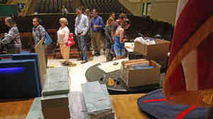 Ballots are stacked and ready as voters wait in line during the 2012 primaries in Milwaukee. An appeals court ruled Monday that a Wisconsin voter ID law, on hold since 2011, could go into effect, but the Supreme Court stepped in on Thursday night to halt the law again as it decides whether to take the case.