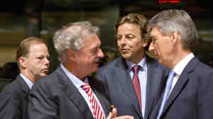 Dutch Foreign Minister Bert Koenders (center) speaks with Luxembourg Foreign Minister Jean Asselborn (second from left) and British Foreign Minister Philip Hammond (right) during a round table meeting of EU foreign ministers in Luxembourg on Monday. The ministers hope to raise 1 billion euros to fight Ebola.