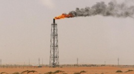 A gas flame is seen in the desert near the Khurais oilfield, about 160 km (99 miles) from Riyadh, Saudi Arabia. REUTERS/Ali Jarekji 
