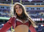 A Washington Redskins cheerleader performs during the first half of an NFL football game against the Tennessee Titans, Sunday, Oct. 19, 2014, in Landover, Md. (AP Photo/Mark E. Tenally)