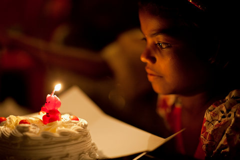During celebrations for her birthday, Poonam, 9, was about to blow out a candle on her cake.