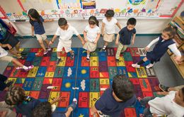 Pre-K students in Josefina Pineda's classroom do the hokey-pokey at the Dallas Independent School District elementary school, Cesar Chavez Learning Center in Dallas, Texas.