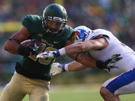 WACO, TX - NOVEMBER 01: Devin Chafin #28 of the Baylor Bears runs the ball against Ben Heeney #31 of the Kansas Jayhawks at McLane Stadium on November 1, 2014 in Waco, Texas. (Photo by Ronald Martinez/Getty Images)