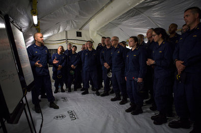 American health care workers and members of the United States Public Health Service who will work at a new hospital were briefed upon arrival in Liberia.