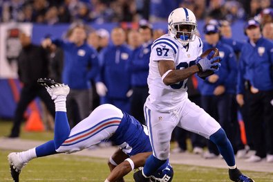 Receiver Reggie Wayne getting past the Giants’ Jayron Hosley en route to a touchdown in the Colts’ 40-24 victory Monday night.