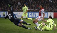 Barcelona’s Lionel Messi, right, scoring his second goal against Ajax. He tied Raúl’s Champions League record of 71 goals.