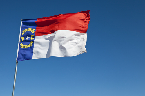 Image Credit: North Carolina flag via Shutterstock.