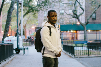 Derrick Lawson outside his building at the Queensbridge Houses in Long Island City last month. Mr. Lawson, 21, is making a second attempt at earning a college degree.
