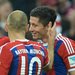 Bayern Munich players congratulated Robert Lewandowski, right, after he scored the first goal against his former team, Borussia Dortmund.
