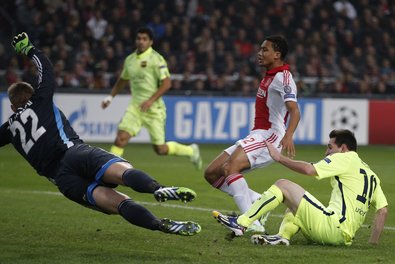 Barcelona’s Lionel Messi, right, scoring his second goal against Ajax. He tied Raúl’s Champions League record of 71 goals.