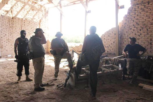 Photos showing dozens of members of the militia groups on the U.S.-Mexico border carrying semi-automatic rifles and wearing masks, camouflage and tactical gear provide one of the first glimpses into the group's activities on the border. Photo: Provided To The San Antonio Express-News