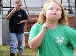 EXCLUSIVE: Honey Boo Boo and family get a new bodyguard at their house in McIntyre, Georgia. After TLC had pulled the plug on the reality hit 'Here comes Honey Boo Boo' the network had replaced the old bodyguards with a new bodyguard to keep an eye on the family and to control the media that has been camping out at the home. Today a new replacement had shown up and was introduced to the family. In the pictures you can see Pumpkin shaking the hand of the new bodyguard. \n\nPictured: Mike Thompson aka Sugar Bear and Alana Thompson aka Honey Boo Boo\nRef: SPL882401  051114   EXCLUSIVE\nPicture by: Jason Winslow / Splash News\n\nSplash News and Pictures\nLos Angeles:\t310-821-2666\nNew York:\t212-619-2666\nLondon:\t870-934-2666\nphotodesk@splashnews.com\n