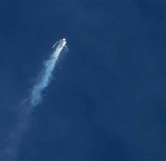 Image: The Virgin Galactic SpaceShip Two rocket explodes in mid-air during a test flight above the Mojave Desert