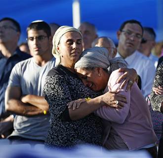 Image: Shaer and Yifrah, mothers of two of the three Israeli teens abducted and killed in the West Bank, mourn during the joint funeral of their sons in Modi'in