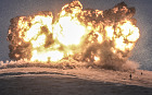 Militants of Islamic State (IS) stand just before explosion of an air strike on Tilsehir hill near Turkish border 