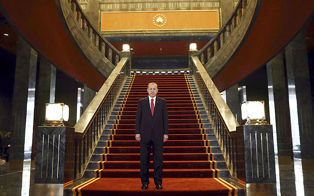 Turkish President Recep Tayyip Erdogan stands inside the new Ak Saray presidential palace