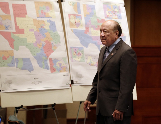Sen. Juan "Chuy" Hinojosa, D-McAllen, looks at maps on display prior to a May 30, 2013, Senate Redistricting Committee hearing. 