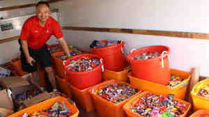 Dr. Curtis Chan, a dentist in Del Mar, Calif., loads up a truck with 5,456 pounds of candy to deliver to Operation Gratitude during the Halloween Candy Buyback on Nov. 8 last year. Chan personally collected 3,542 pounds of candy from patients.